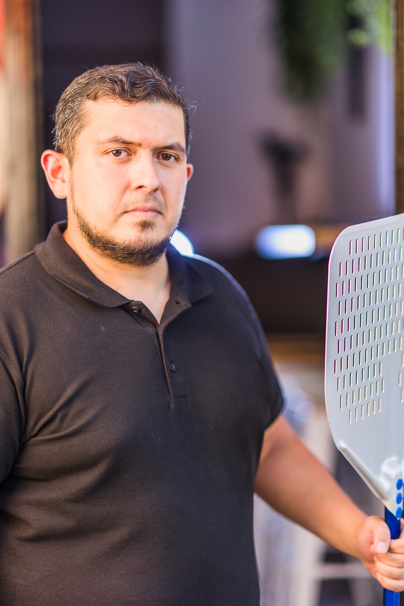 Latin mid chef entrepreneur with professional uniform. successful owner manager. venezuelan man